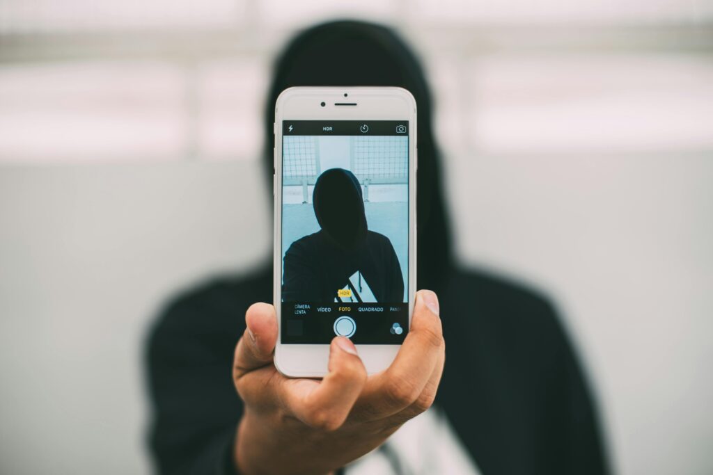 Anonymous student behind phone